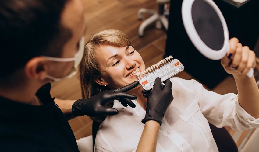 patient looking in the mirror for veneers
