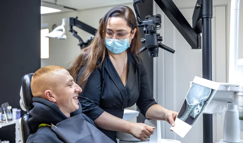 doctor showing xray to patient
