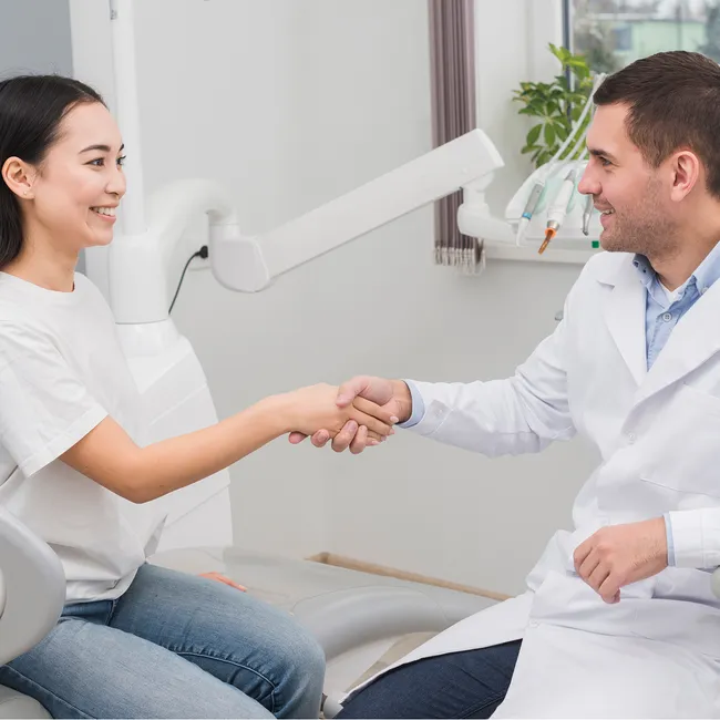 doctor shaking hands with patient